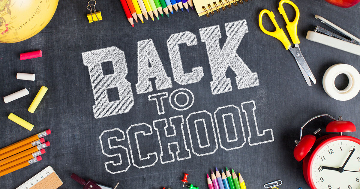 School supplies on blackboard background